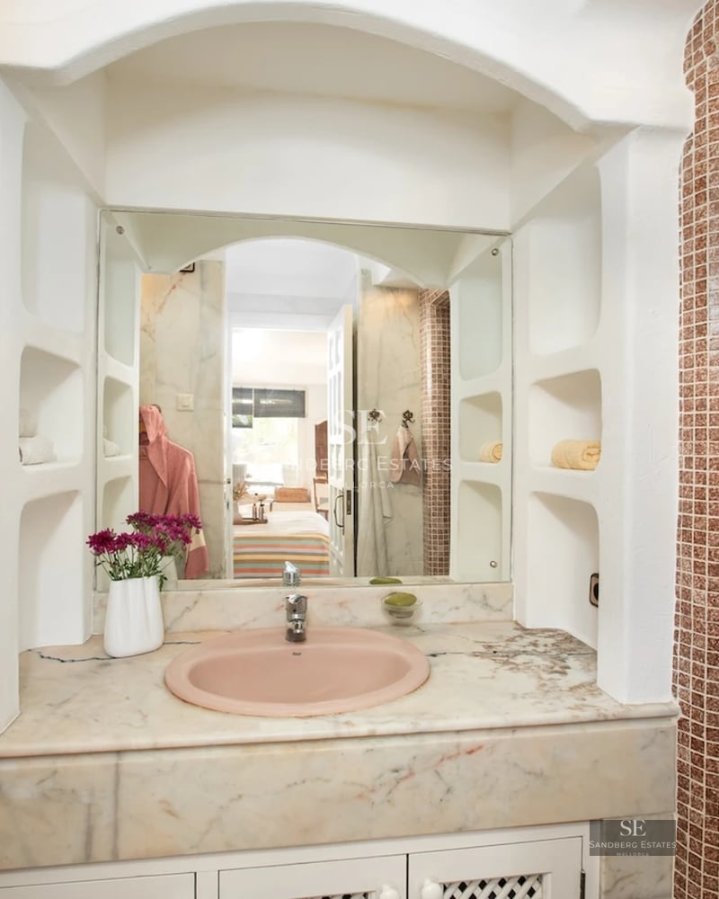 Exterior view of a modern villa with pool, landscaped garden, and spacious terraces. Elegant architecture and high-end finishes.