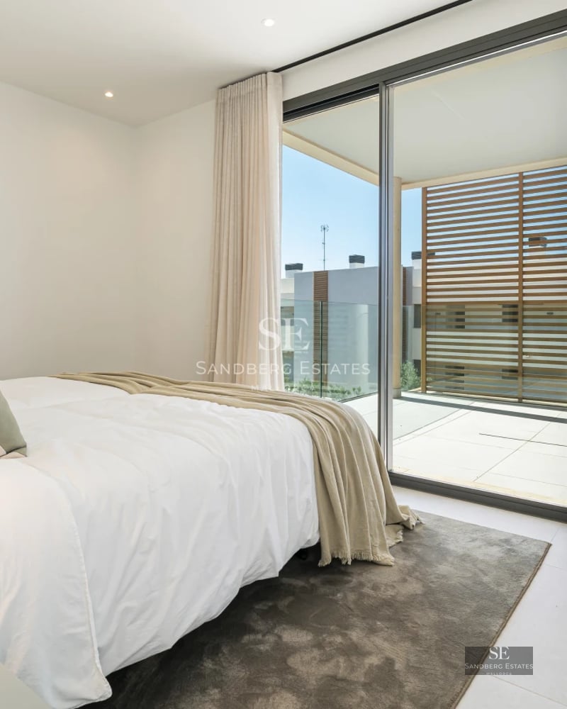 Expansive terrace with infinity pool, sun loungers, and sea views. Modern design featuring high-quality materials and abundant natural light.