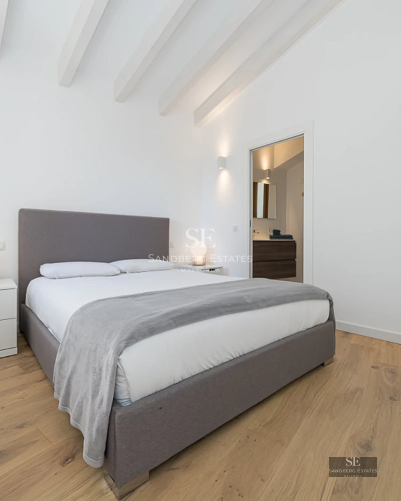 Panoramic view of a modern villa with a pool, lush garden, and spacious terraces. Elegant and minimalist design.