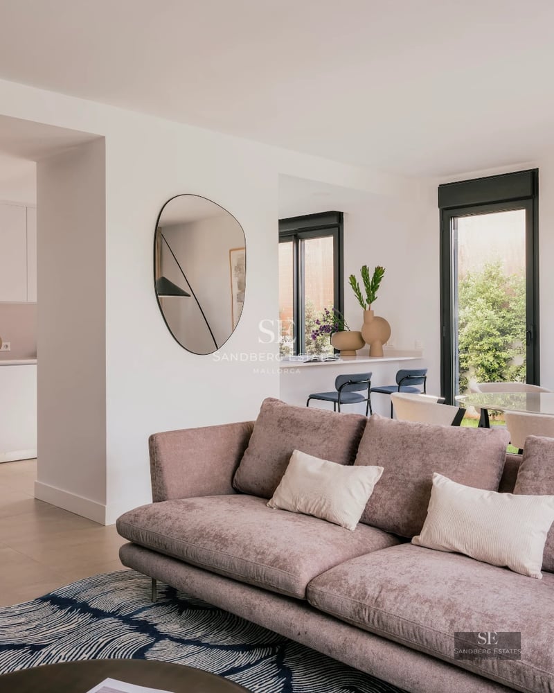 Exterior view of a modern villa featuring an infinity pool, lush garden, and spacious terraces. Contemporary and elegant architecture.