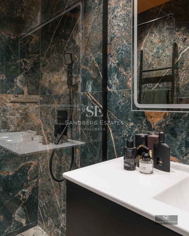 Minimalist facade with reflective pool. Modern design featuring large windows and lush greenery. Ambient lighting.