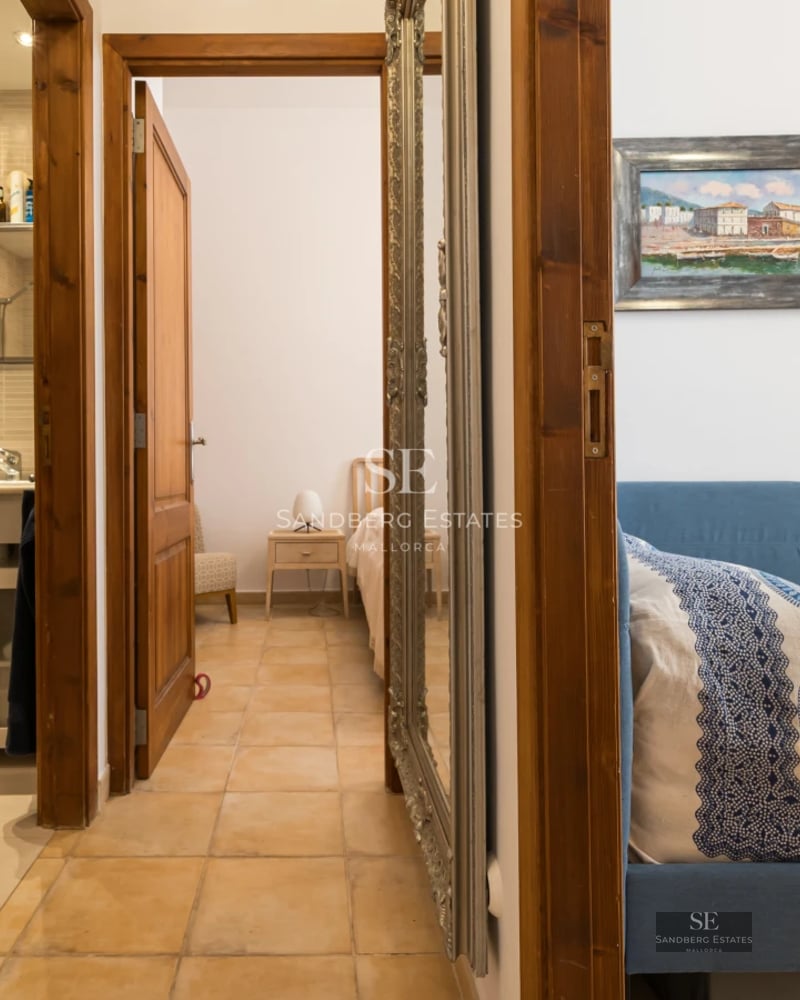 Exterior view of a modern villa featuring an infinity pool, lush garden, and minimalist architecture. Soft lighting and expansive terraces.