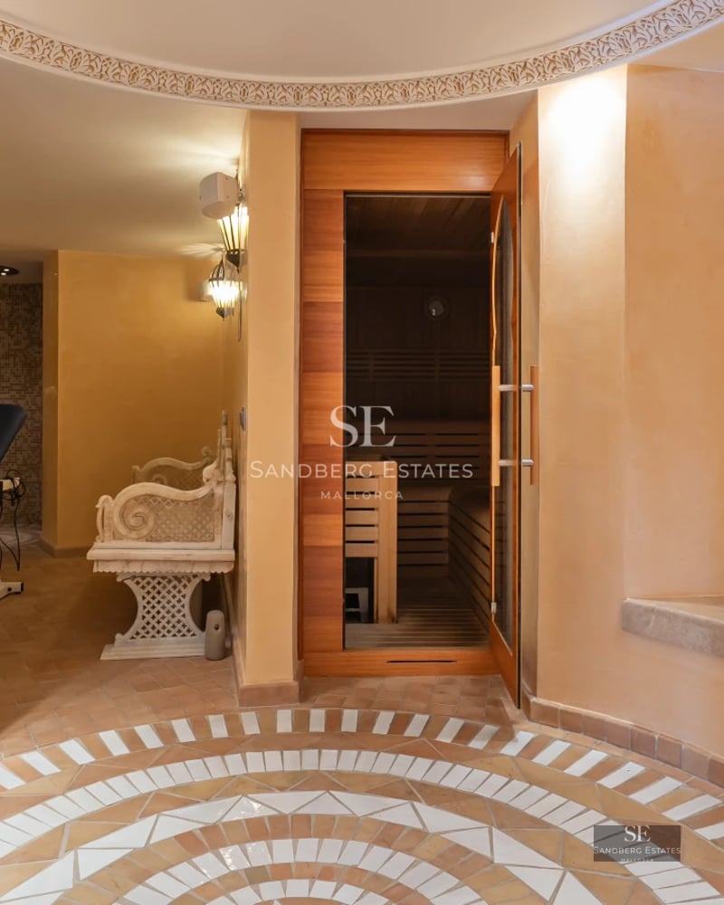 Exterior view of a modern villa with a pool. Minimalist design, large windows, manicured landscaping. Reflections in the water.