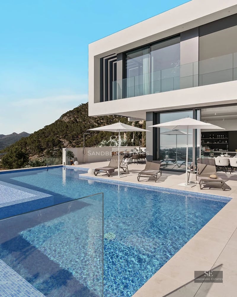 Exterior view of a modern villa featuring a pool, manicured garden, and expansive terraces. Minimalist architectural design with clean lines.