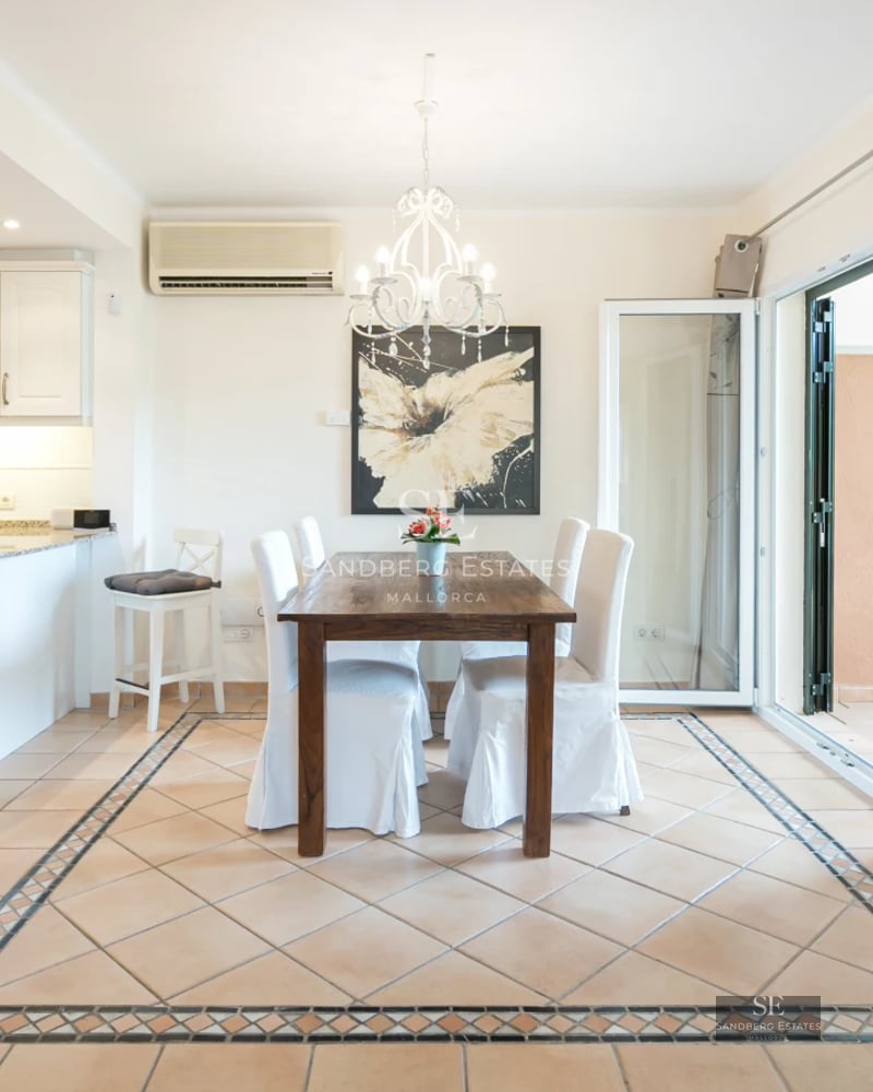 Expansive terrace with infinity pool. Panoramic sea views. Modern design with elegant outdoor furniture and lush vegetation.