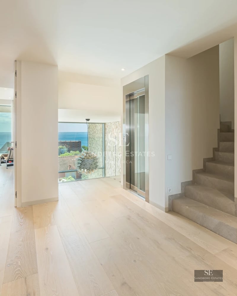 Modern exterior with infinity pool, expansive terraces, and panoramic views. Minimalist design with clean lines and abundant natural light.