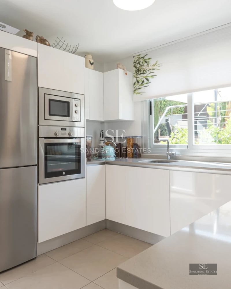 Exterior view of a modern villa with pool, expansive terraces, and minimalist architectural design. Soft ambient lighting.