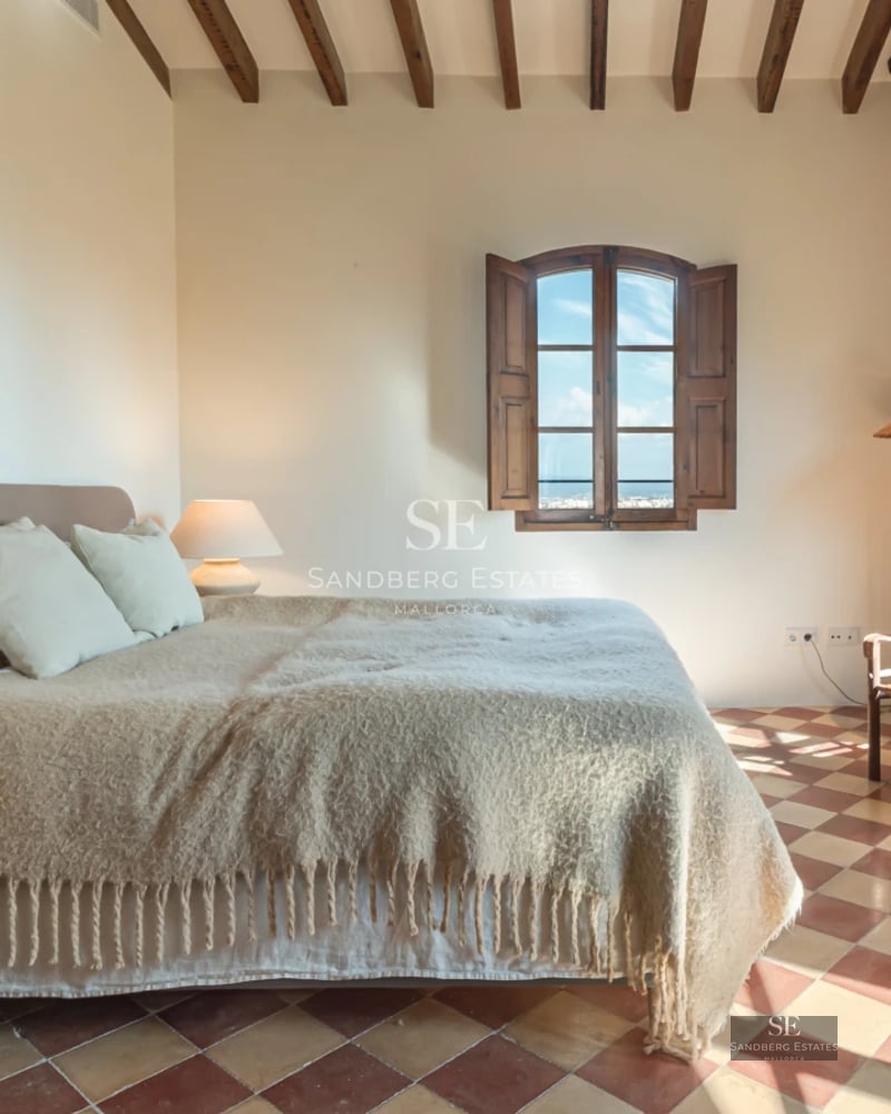 Spacious balcony with sea view. Minimalist design with modern furniture. Glass railing offering panoramic views. Natural lighting.