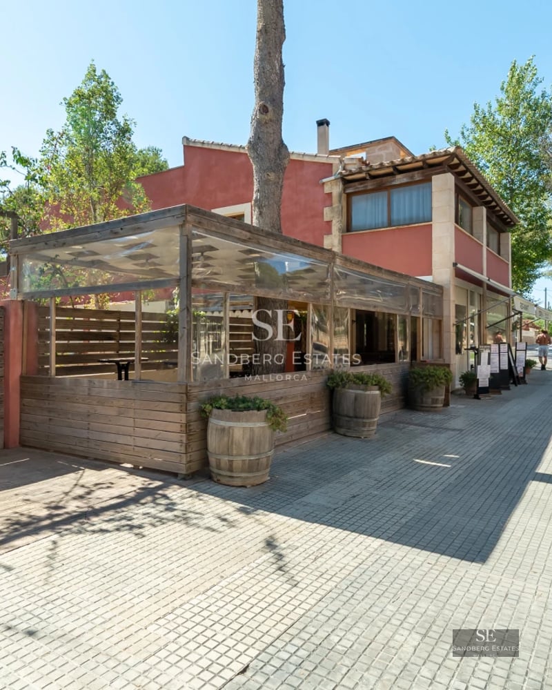 Exterior view of a modern villa featuring an infinity pool, lush garden, and expansive terraces. Minimalist architectural design.