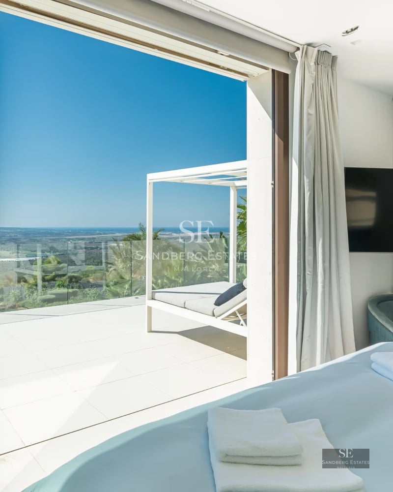 Exterior view of modern villa with infinity pool, spacious terraces, and lush garden. Minimalist architecture with panoramic windows.