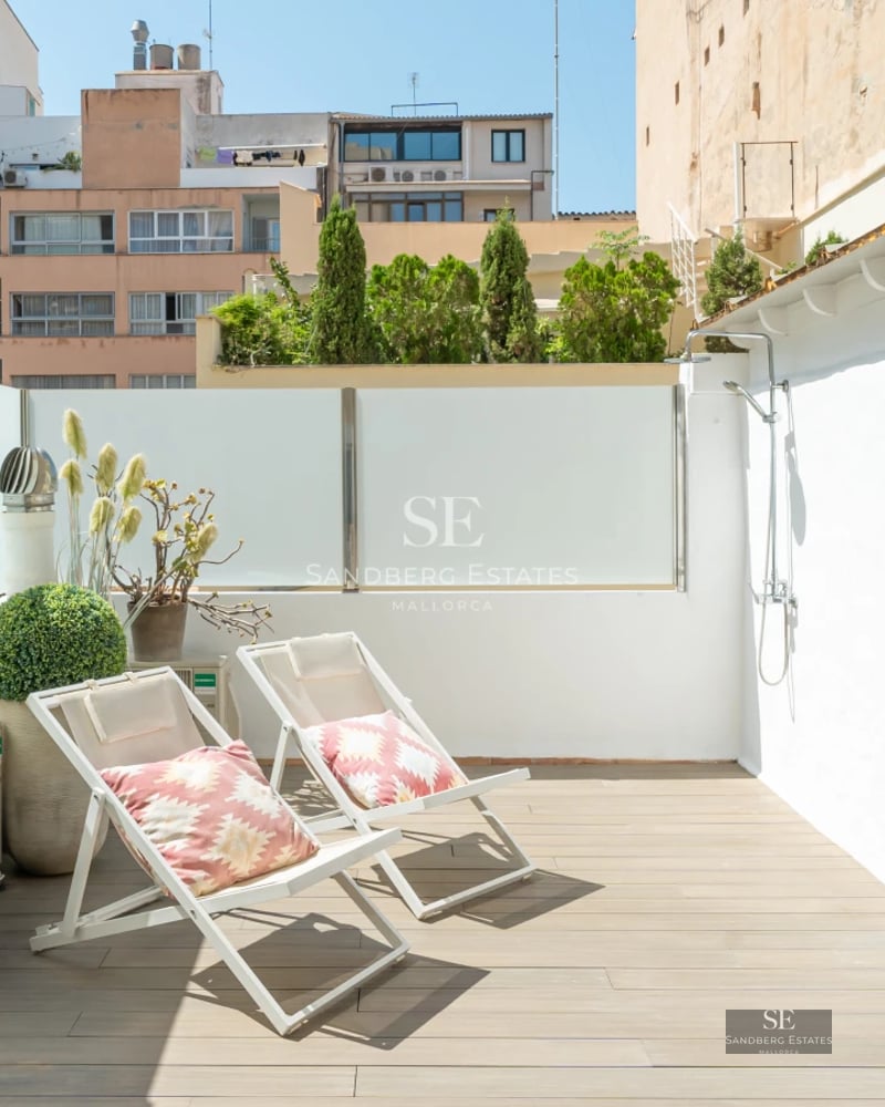 Expansive terrace with infinity pool, sun loungers, and spectacular views. Modern, minimalist design with high-quality materials.