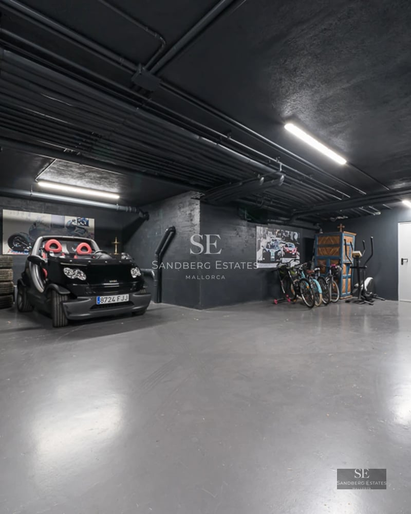 Bright living room with large windows, light wood floors, and elegant furniture. Panoramic sea views and integrated balcony.