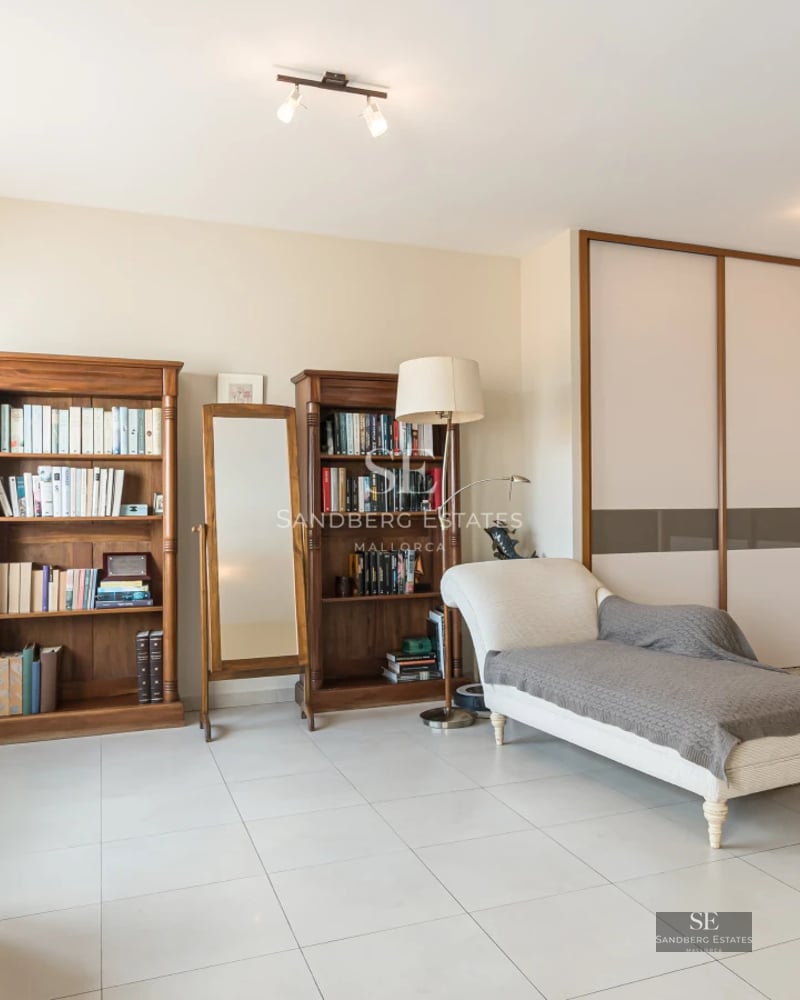 Exterior view of modern villa with infinity pool, large terraces, and minimalist architectural design. Warm lighting and lush landscaping.