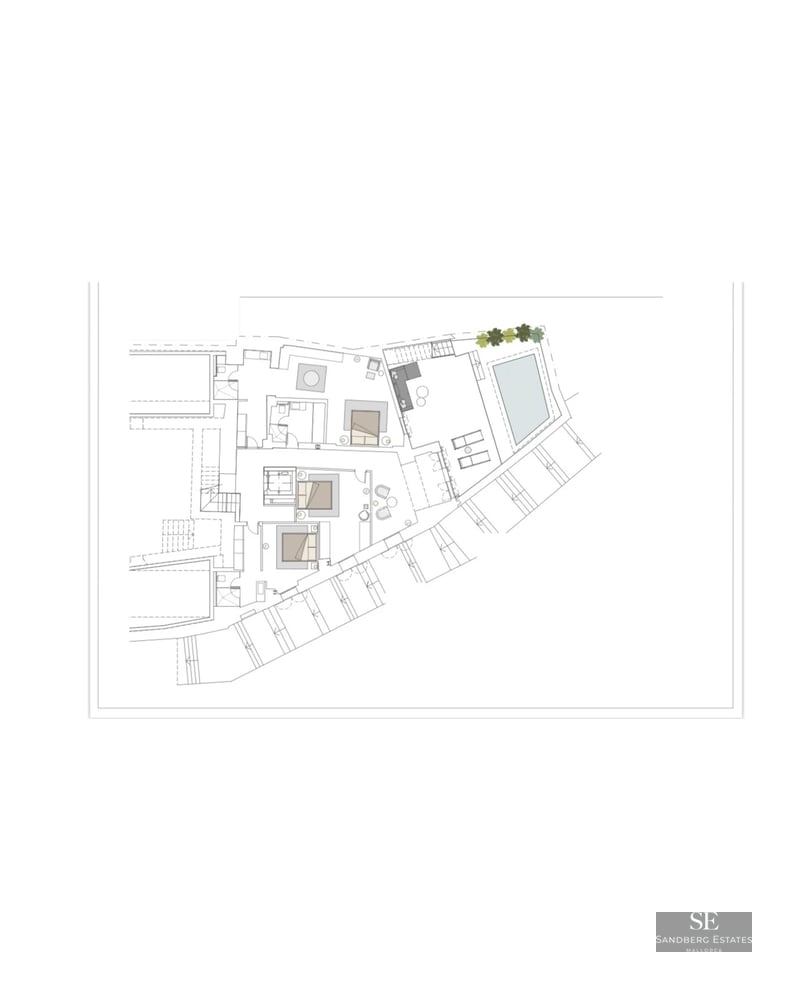 View of a luxurious pool surrounded by a modern villa with large windows and lush vegetation. Minimalist design and high-quality finishes.