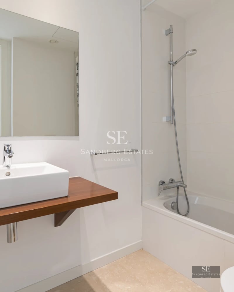 Aerial view of modern villa with infinity pool, manicured garden, and minimalist architectural design featuring clean lines.