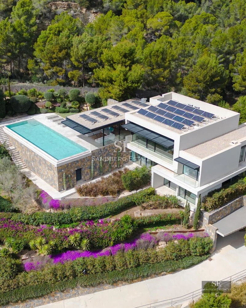 Expansive terrace featuring an infinity pool, panoramic views, and modern furniture. Minimalist architecture with luxurious touches.