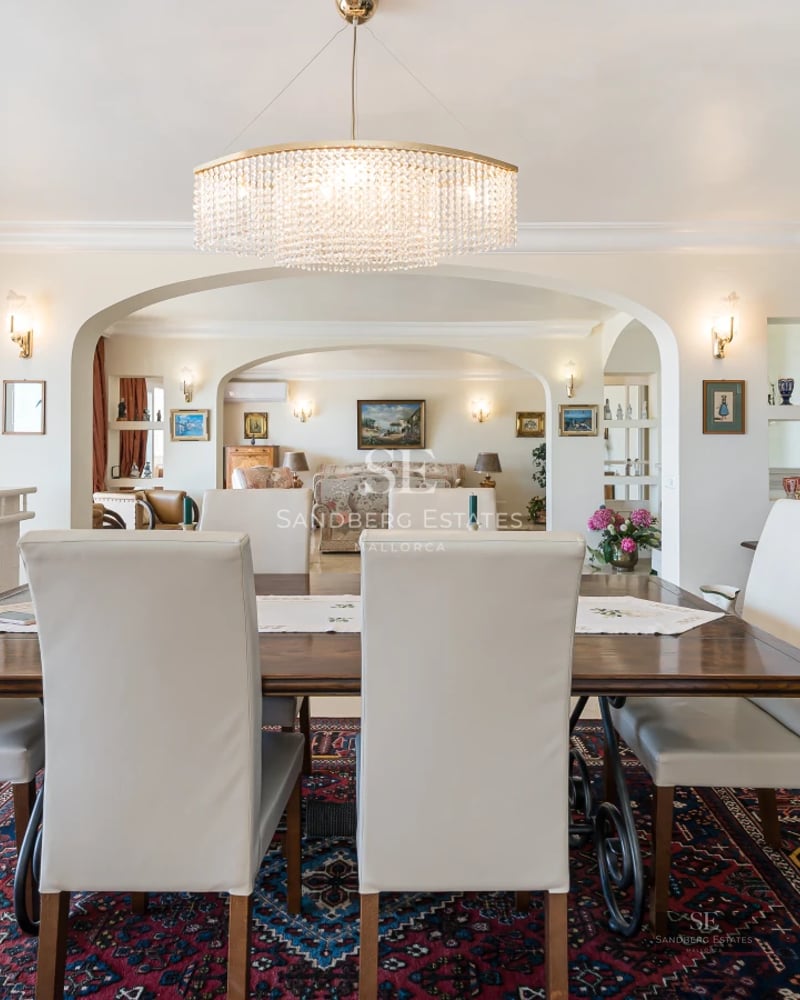 Exterior view of a modern villa with a pool, manicured garden and large terraces. Minimalist and elegant architecture.