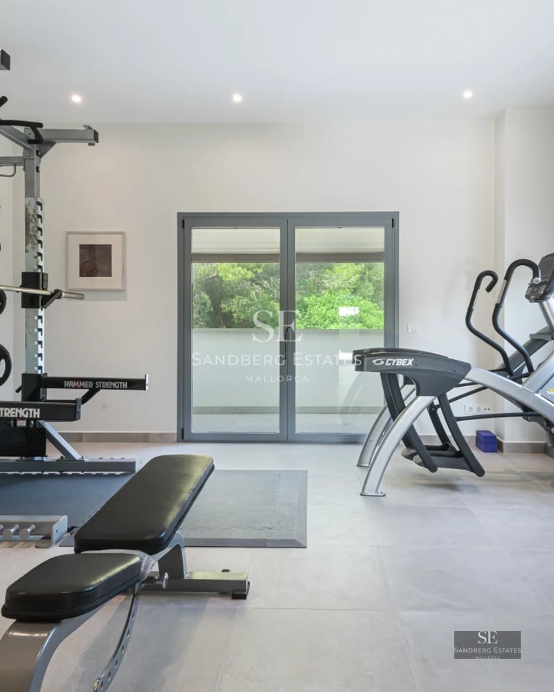 Exterior of a modern villa with an infinity pool, lush garden, and spacious terraces. Minimalist architectural design with panoramic windows.