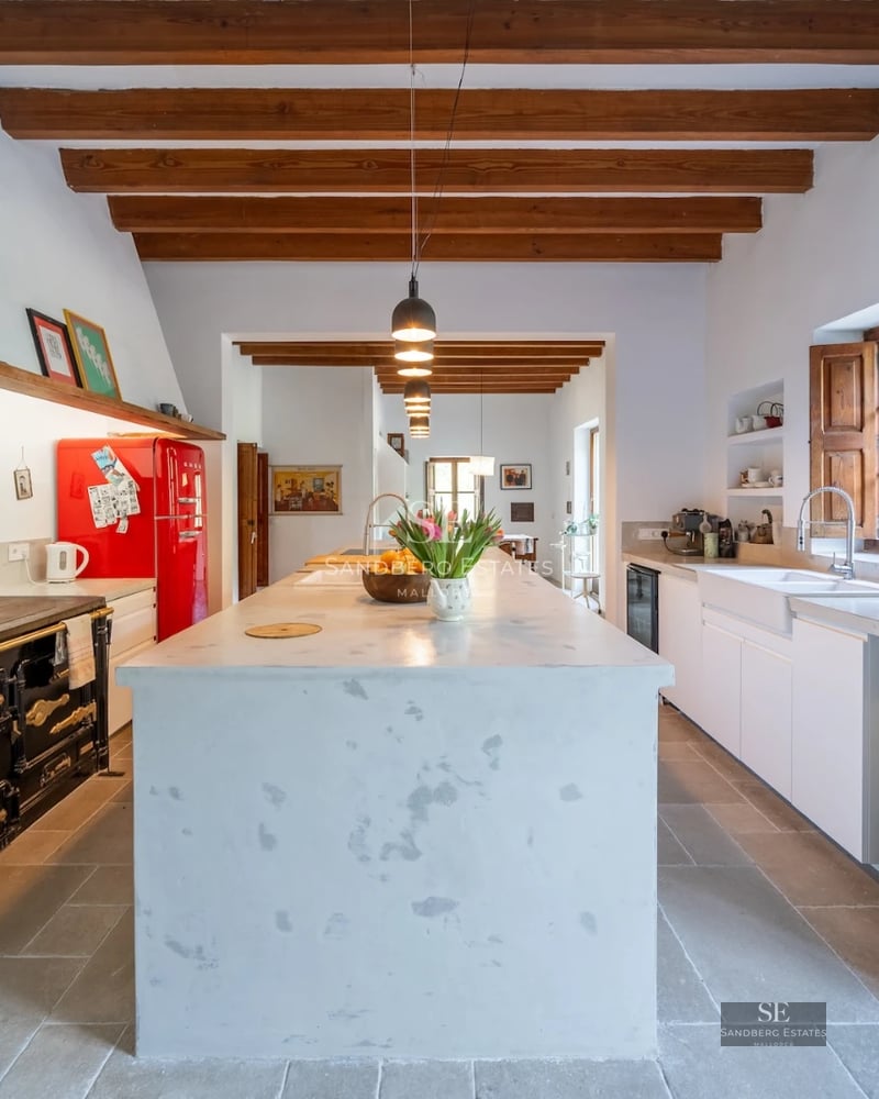 Spacious balcony with sea views, designer furniture, wooden floor, and glass railing. Luxurious and modern.