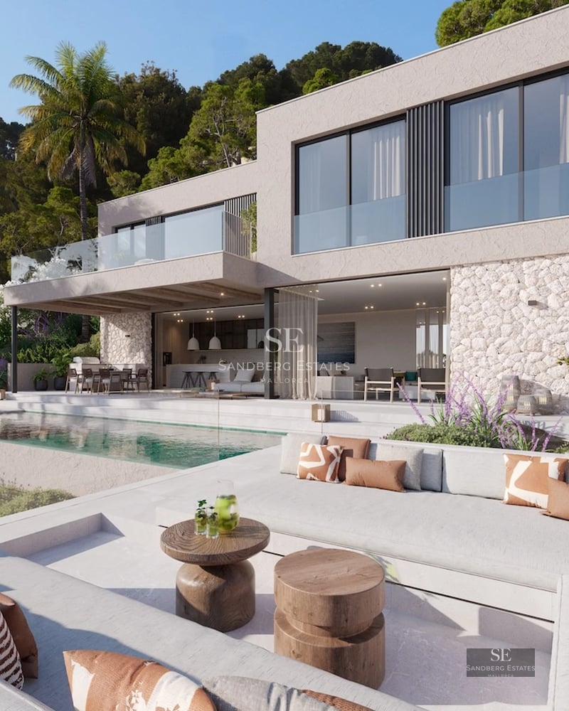 Infinity pool view with sun loungers, outdoor living area, and panoramic sea views. Modern design with clean lines and luxury finishes.