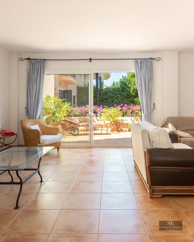Exterior view of a modern villa featuring an infinity pool and lush garden. Minimalist architecture with large windows and expansive terraces.