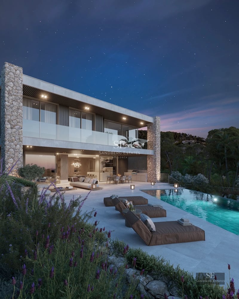 View of a luxurious, reflective pool surrounded by lush greenery & modern architecture. Natural stone & wood details are featured.
