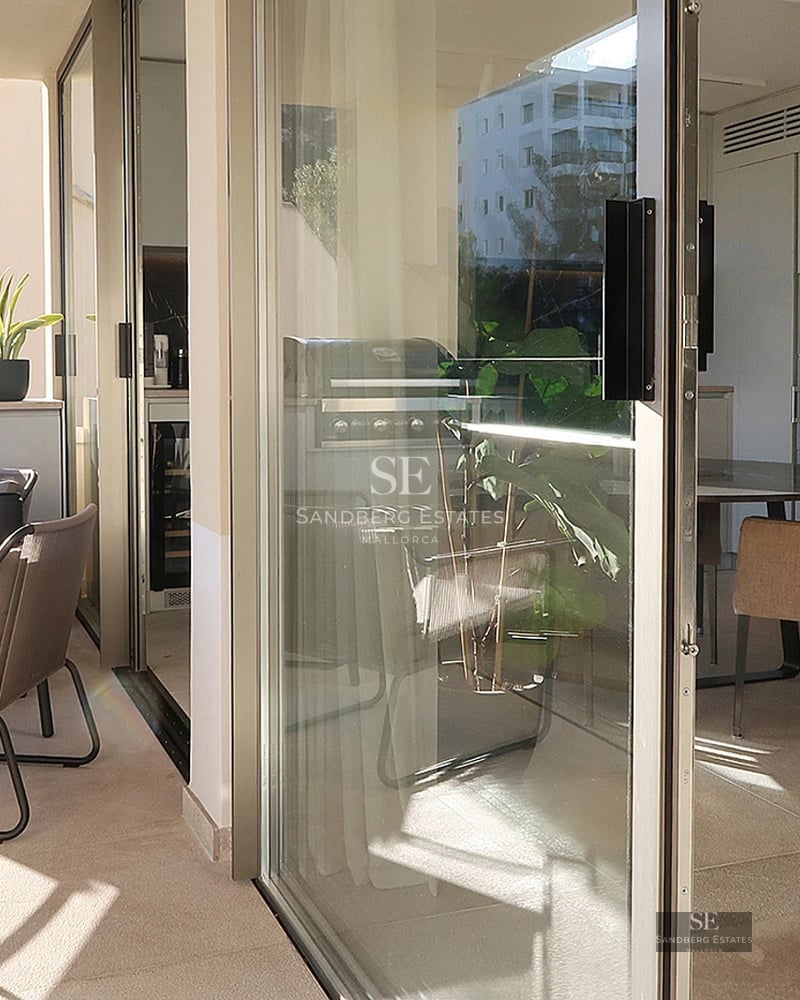 Aerial view of a modern villa with infinity pool, surrounded by lush gardens. Contemporary design and luxury finishes.