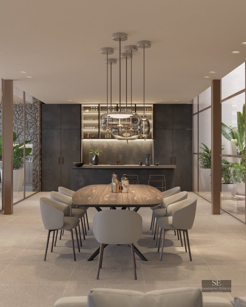 Elegant dining room featuring a wooden table, designer pendant lights, and floor-to-ceiling glass walls.
