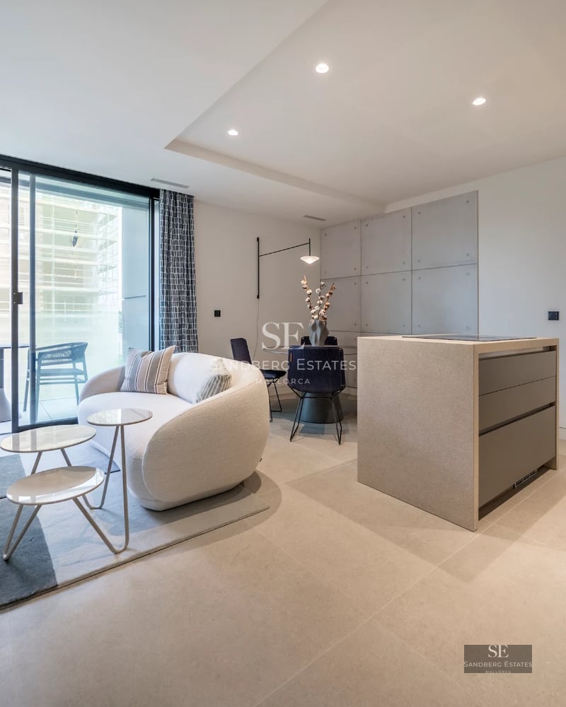 Large swimming pool surrounded by lush vegetation. Modern architecture with large windows and covered terrace. Luxurious and relaxing atmosphere.