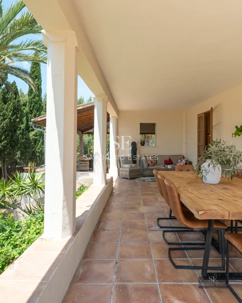 Exterior view of a modern villa with pool, lush garden, and spacious terraces. Minimalist architecture, perfect for relaxation.