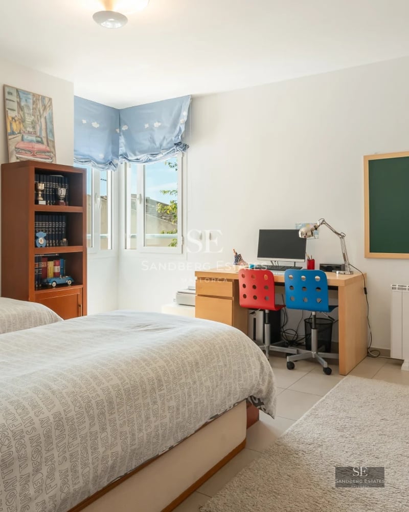 Exterior of a modern villa featuring an infinity pool, expansive terrace, and lush gardens. Minimalist design with large windows.
