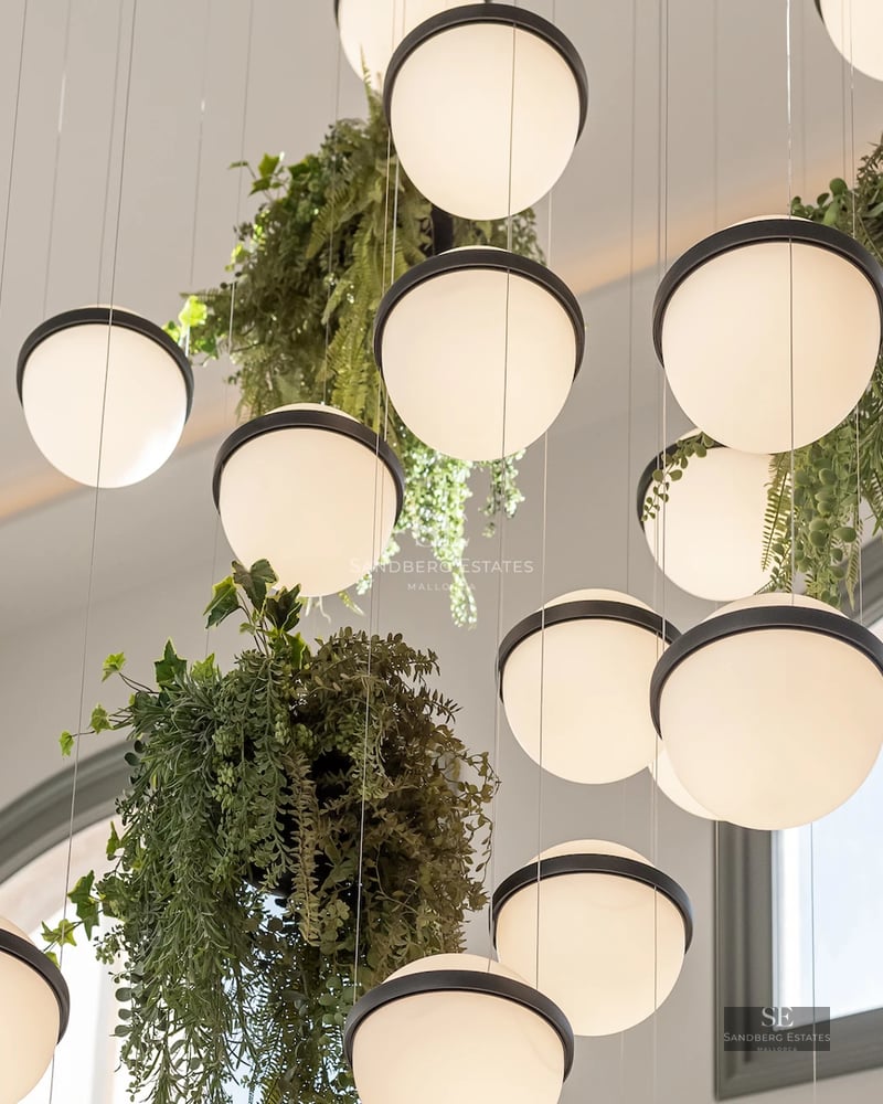 Expansive terrace with a pool and panoramic views. Modern design with clean lines and neutral colors. Abundant natural lighting.