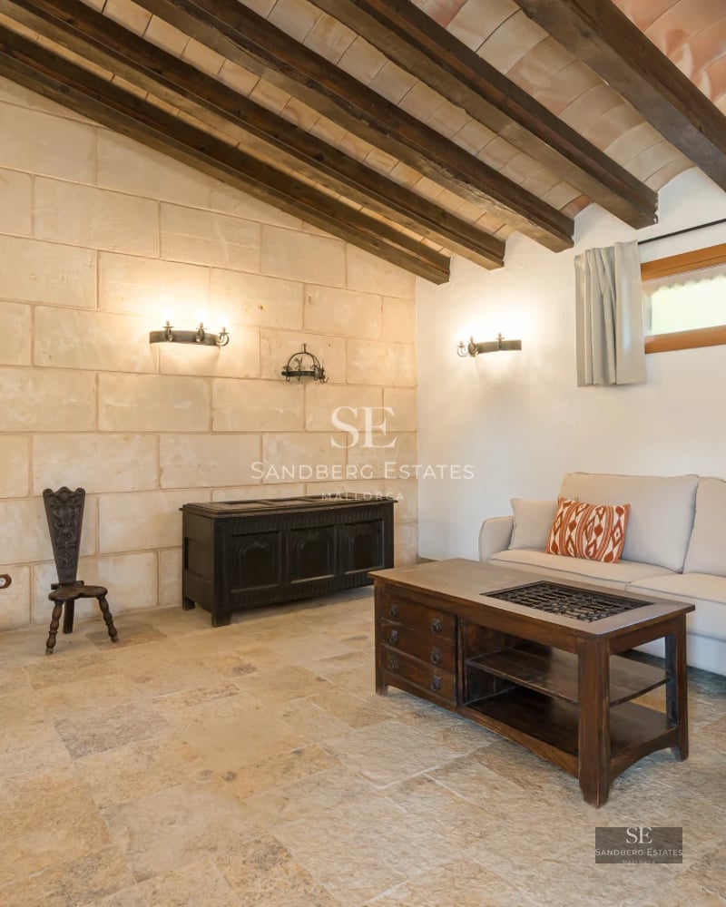 Exterior of a modern villa featuring a reflective pool, large windows, and manicured landscaping. Soft ambient lighting.