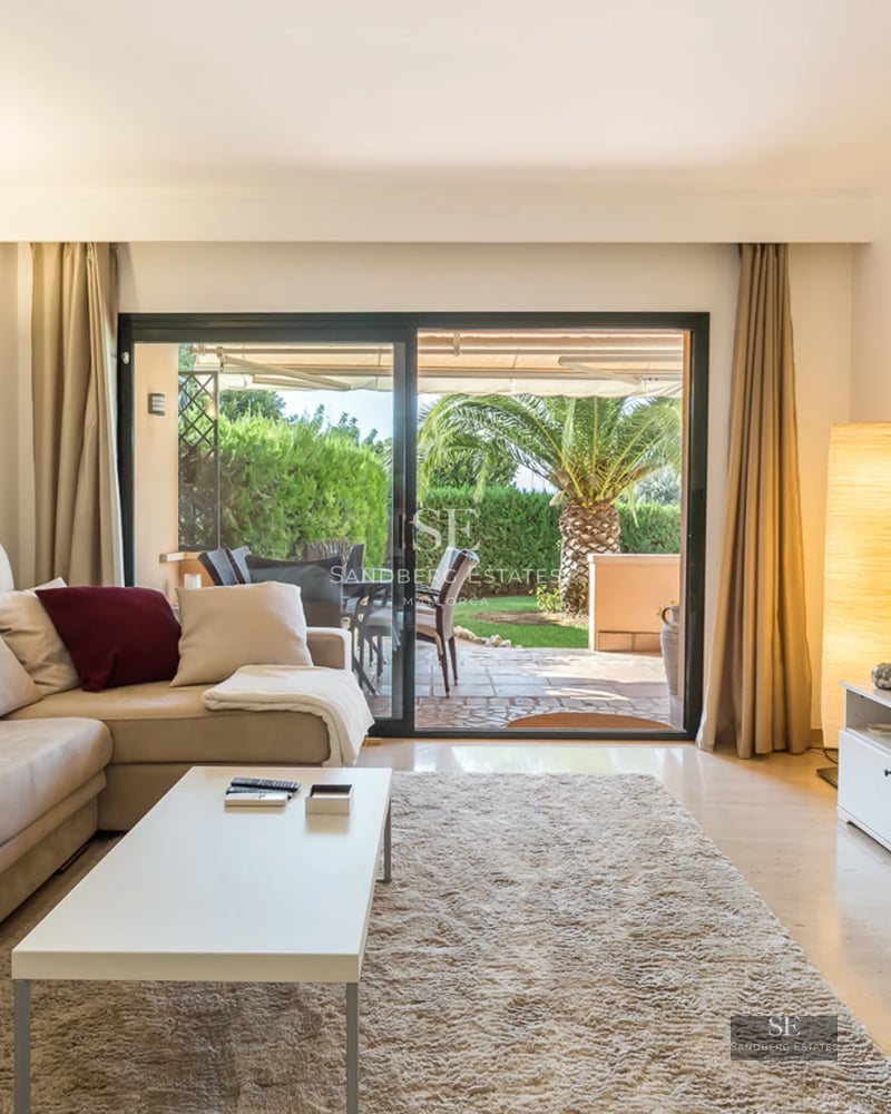 Exterior view of a modern villa featuring an infinity pool, lush greenery, and minimalist architecture. Sleek design with natural light.
