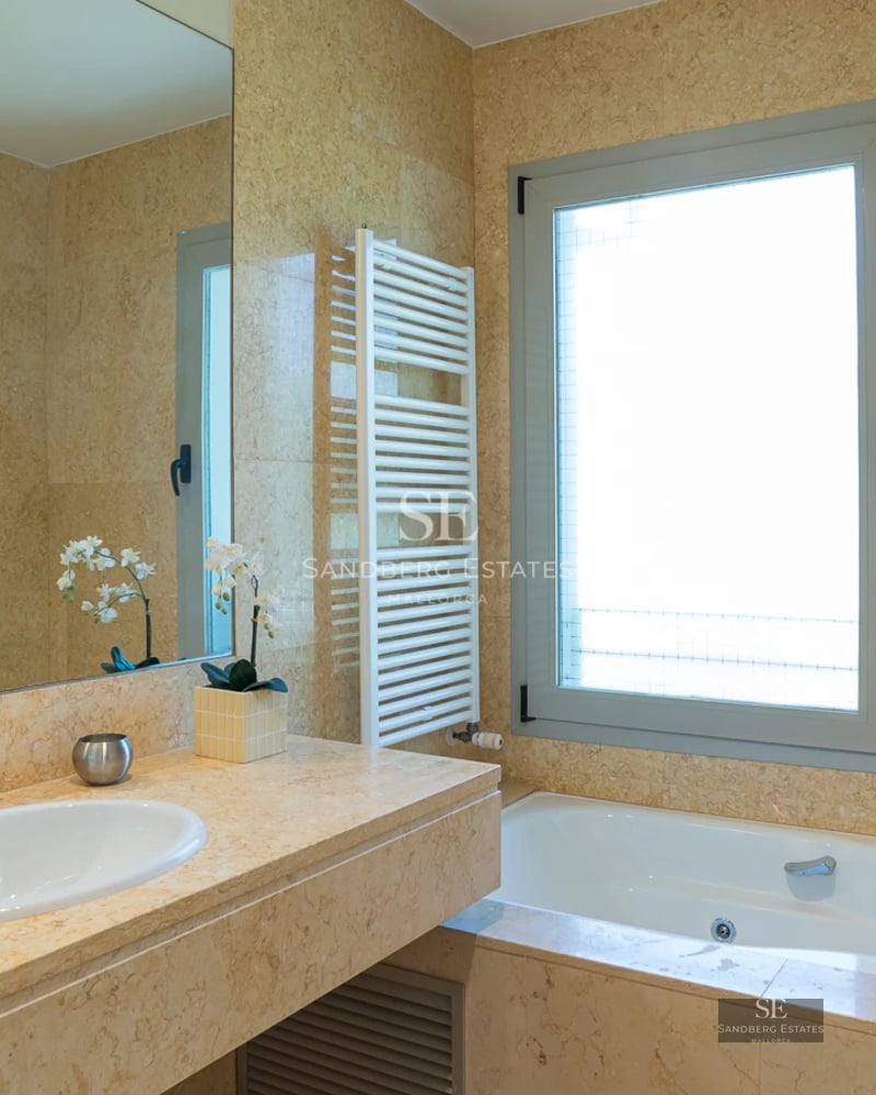 Exterior view of a modern villa with a pool, lush garden, and elegant architecture. Minimalist design and high-quality finishes.