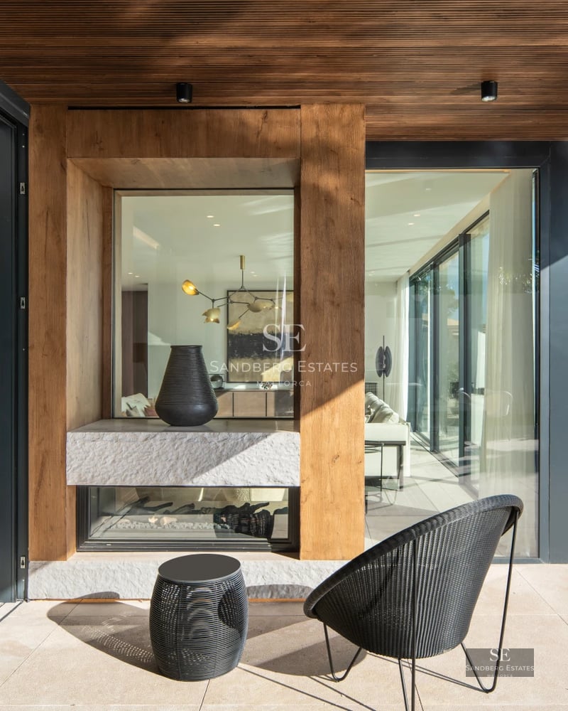 Exterior of a modern villa featuring a pool and lush garden. Elegant architecture, large windows, and manicured landscaping.