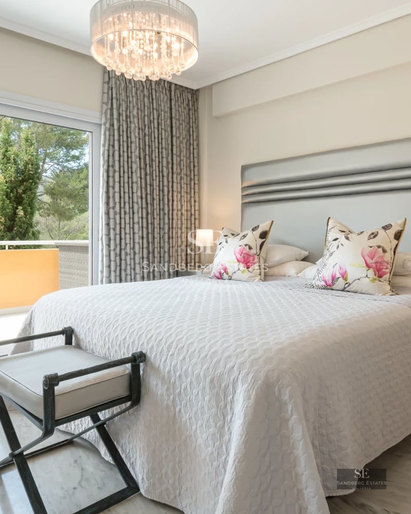 Spacious terrace with infinity pool, sun loungers, and sea view. Modern design with elegant finishes.