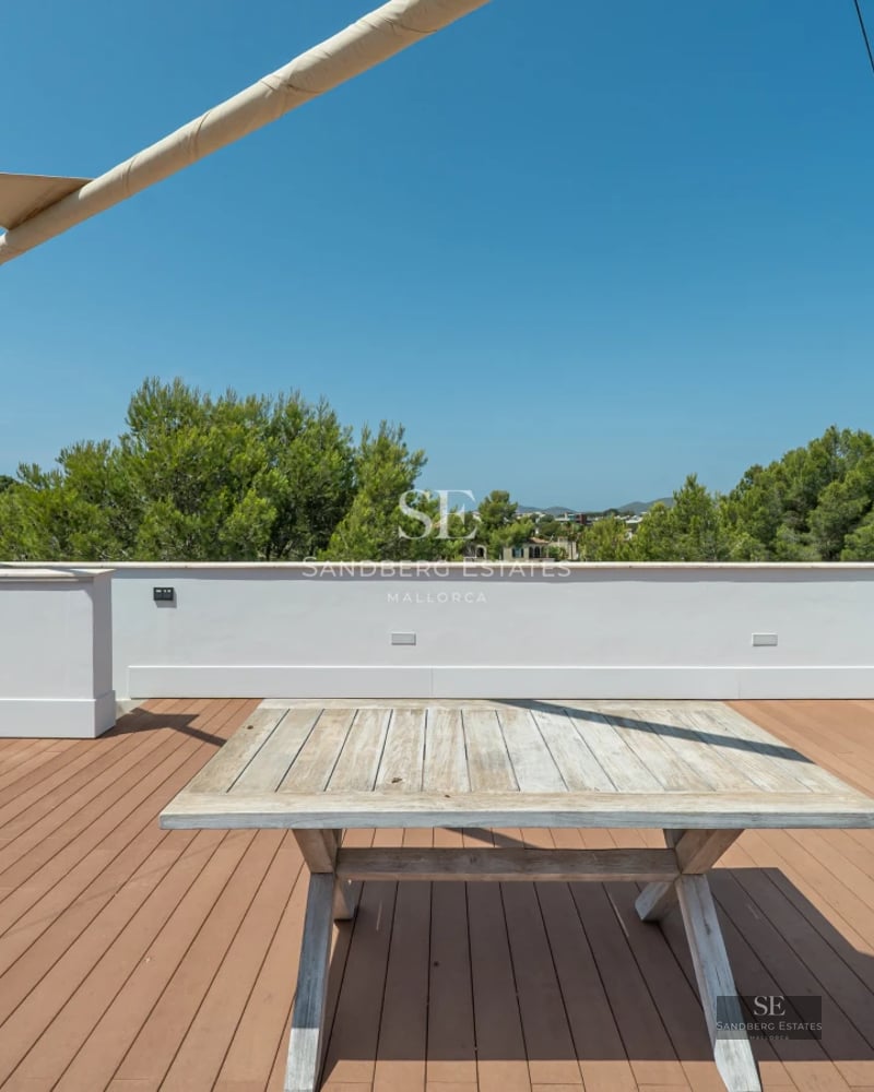 Exterior of a modern house with pool, lush garden, and minimalist architecture. White facade, large windows, and sleek design.