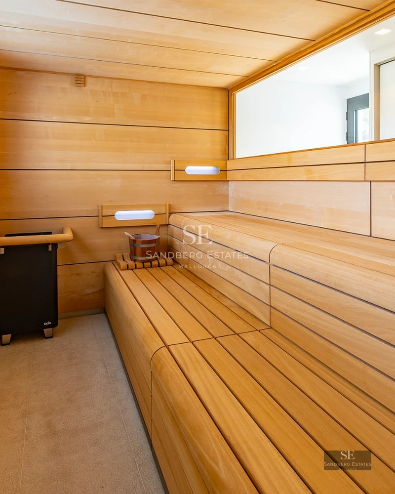 Exterior of a modern villa featuring a pool, garden, and large windows. Clean and contemporary architectural design.