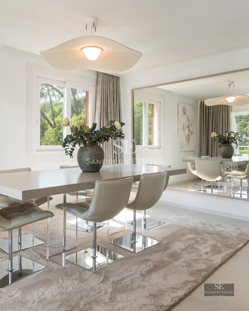 Exterior view of a modern villa with infinity pool, landscaped gardens, and expansive terraces. Minimalist design and natural light.