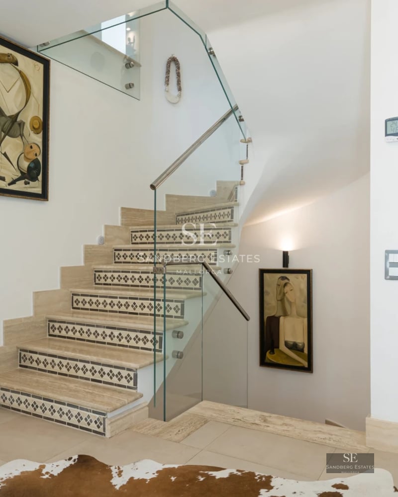 Exterior view of a modern villa featuring a swimming pool, lush garden, large windows, and designer architecture. Natural lighting.