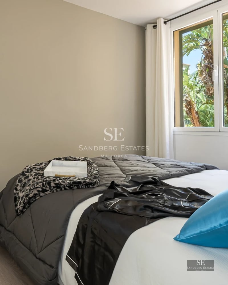 Exterior view of a modern villa featuring an infinity pool, manicured lawn, and designer furniture. Minimalist architecture and large windows.