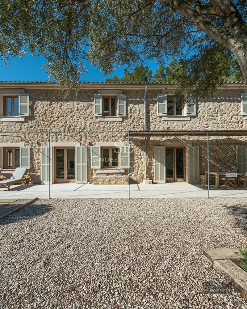 Spacious terrace with pool and seating area. Modern, minimalist architecture. Garden views. Ideal for relaxation and entertainment.