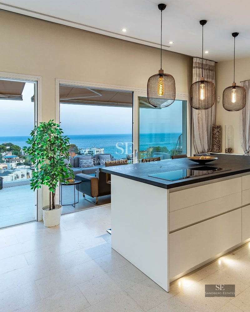 Exterior of a modern villa featuring a pool, garden area, and large windows. Minimalist architecture and manicured landscaping.