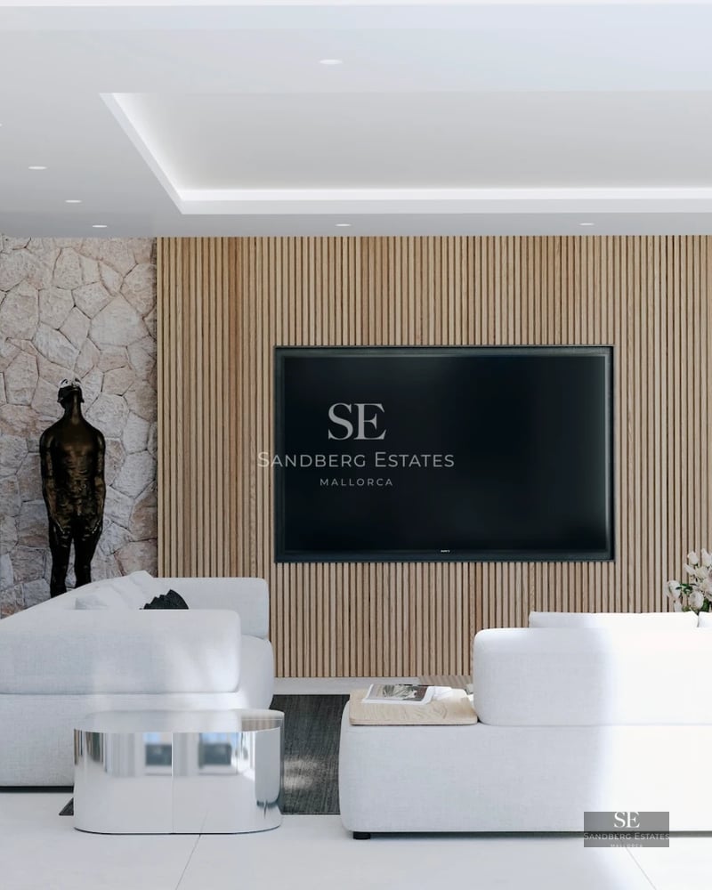 Spacious, bright living room with large windows, modern furniture, and access to a terrace with spectacular views.