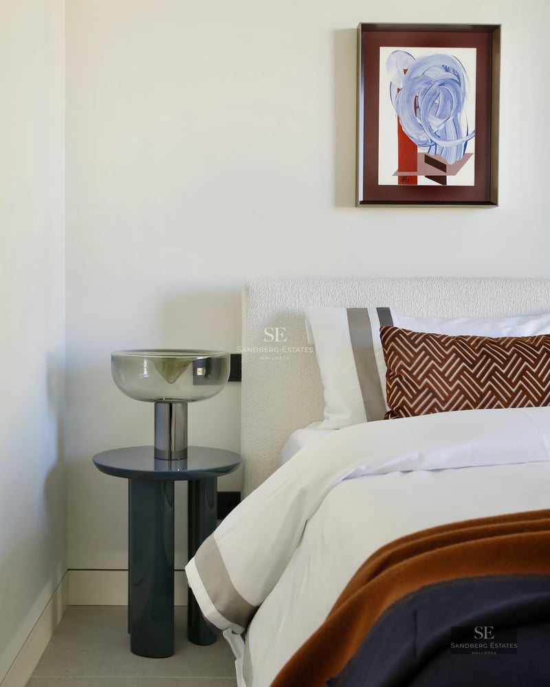 Exterior view of a modern villa with an infinity pool, large windows, and lush gardens. Minimalist architecture with wooden accents.