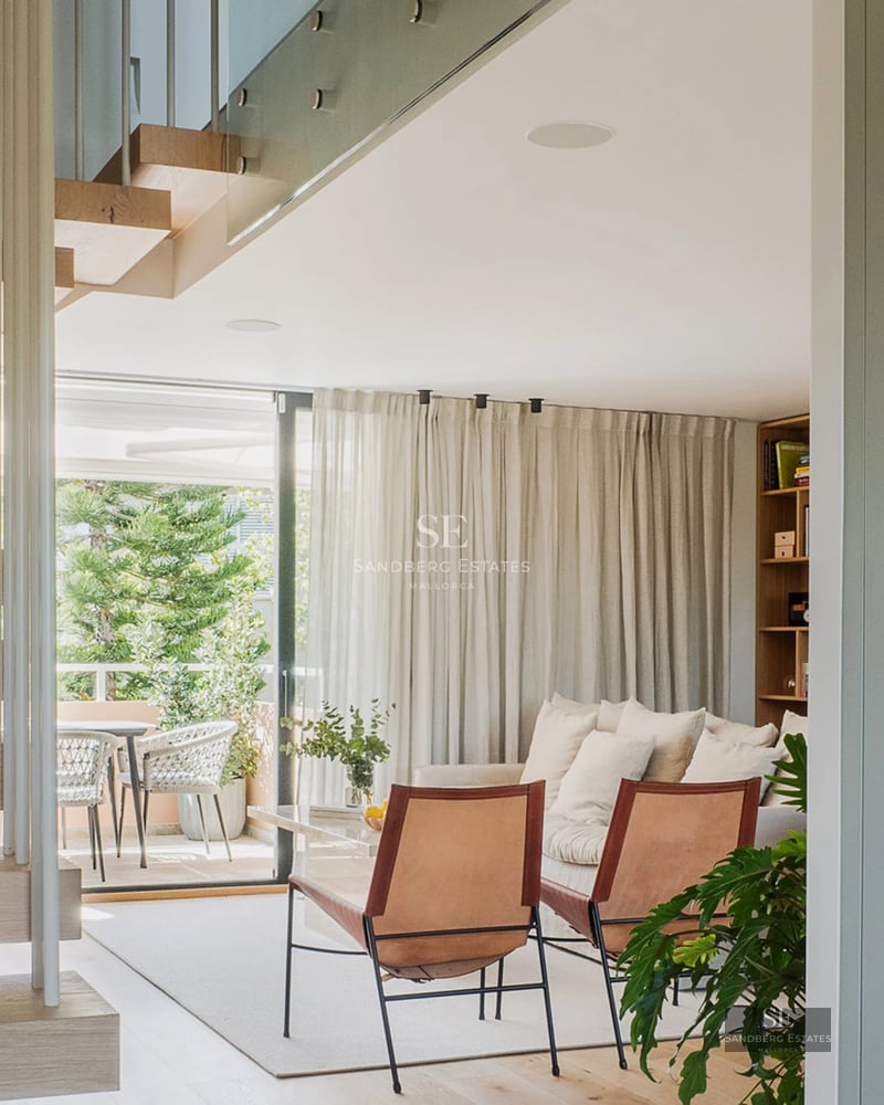 Exterior view of a modern villa featuring an infinity pool, expansive terraces, and lush garden. Contemporary architectural design.