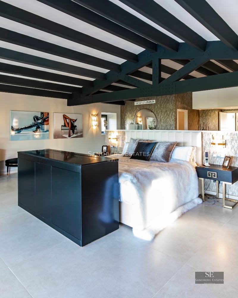 Spacious terrace with infinity pool and ocean view. Modern architecture featuring elegant furniture and lush landscaping.