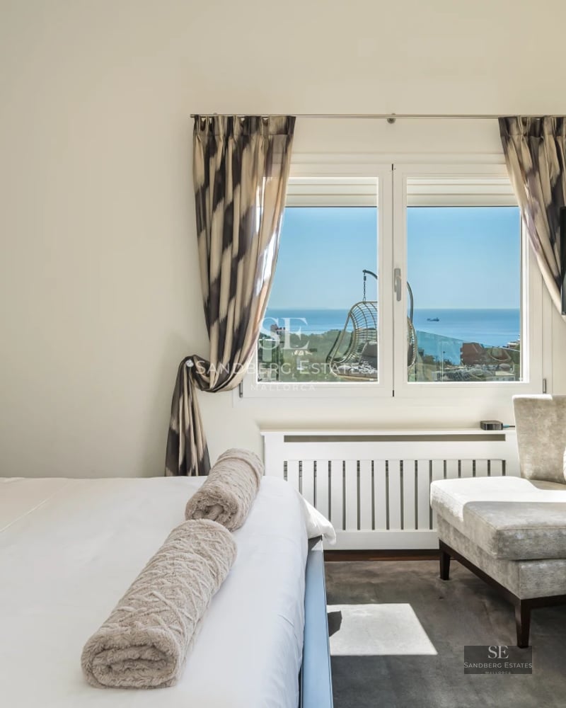 Exterior view of a modern villa with infinity pool, spacious terraces, and lush garden. Minimalist and elegant architecture.