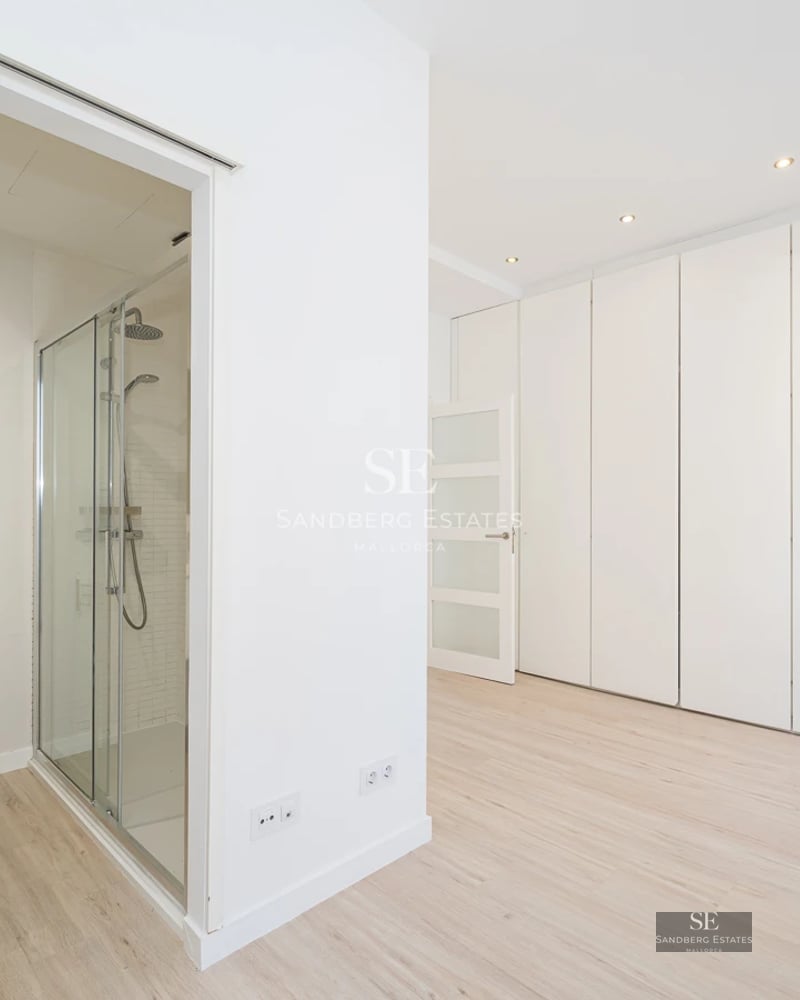 Panoramic view of a modern villa with infinity pool and spacious terraces. Minimalist design and abundant natural light.